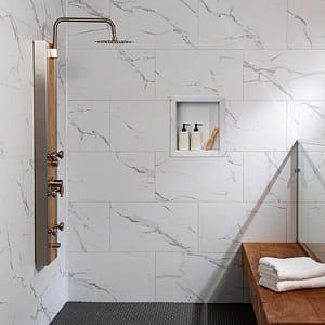 Palisade wall tile and shower niche in Carrara Marble