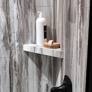 Shower shelf in Louvre Granite