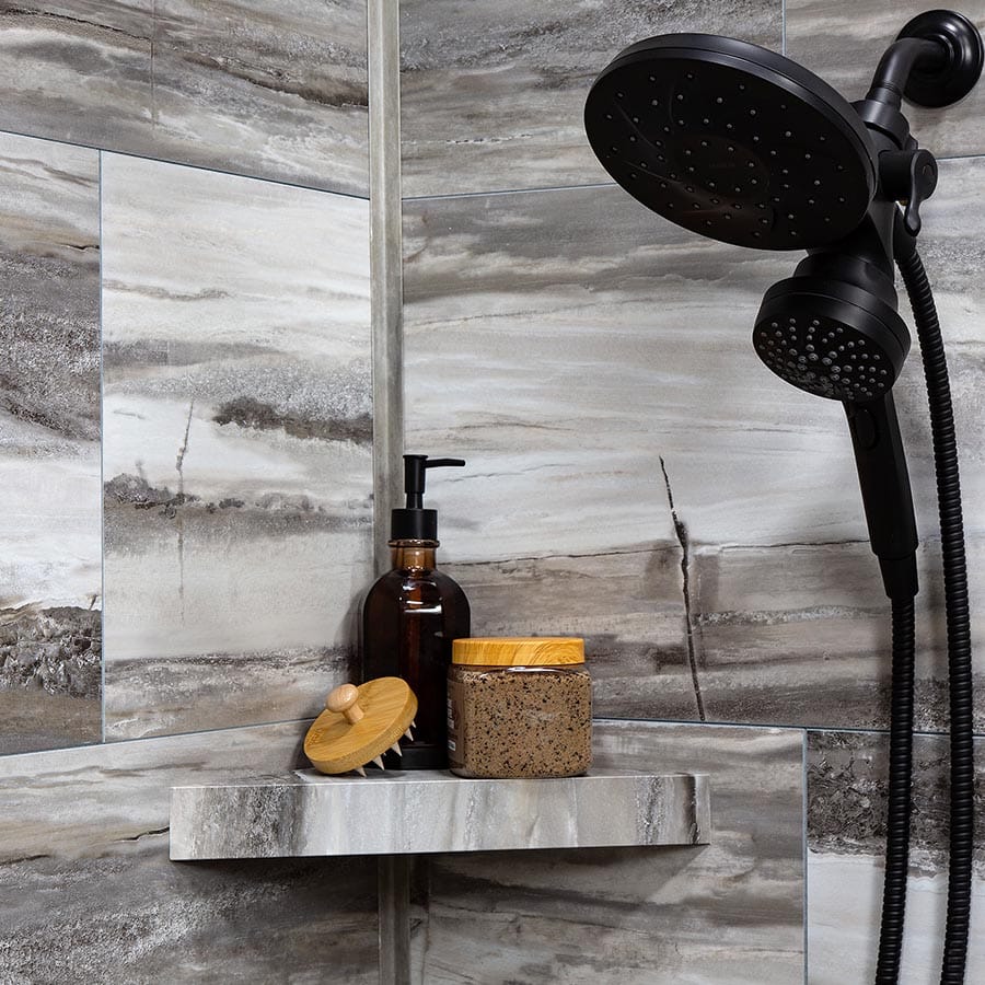 Installed shower shelf in Louvre Granite