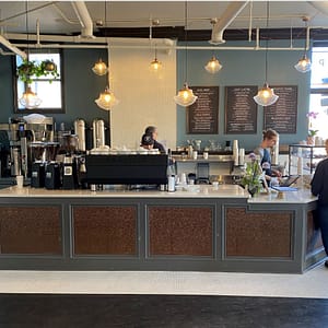 Studio  Coffee Bar - Fasade Hammered Wall Panel in Oil-Rubbed Bronze