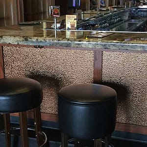 Milwaukee Burger - Fasade Hammered Wall Panel in Oil-Rubbed Bronze
