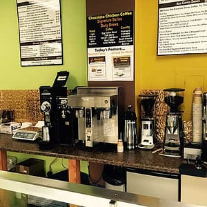 Chocolate Chicken Coffee Shop - Fasade Traditional 1 Wall Panel in Polished Copper