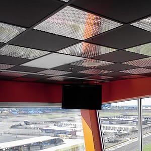 Charlotte Motor Speedway - Genesis Smooth-Pro Ceiling Panels in Black and Fasade&#039;s Diamond Plate in Brushed Aluminum