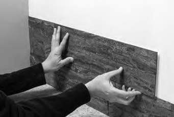 Carefully ti tile up into place so it butts the last tile