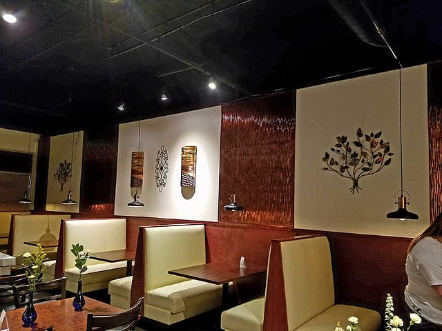 Genuwines Vintage Dining, Pickerington, OH. Fasade Dunes Wall Panels in Moonstone Copper.