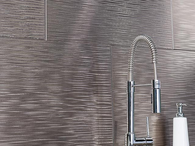 Ripple backsplash in Brushed Nickel